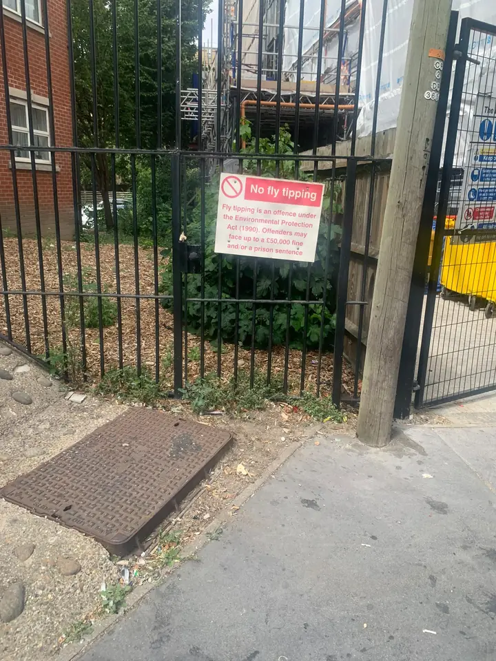 Fence and pavement after the pictured items were removed.